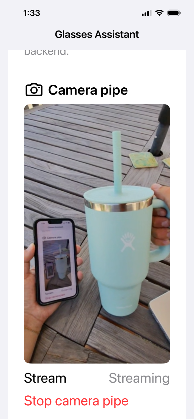 Glasses Assistant camera pipe showing a live first-person view of a cup